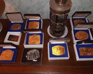 Multiple vintage John Deere belt buckles