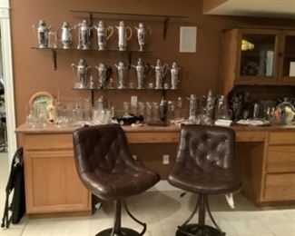 More martini shakers and leather bar stools