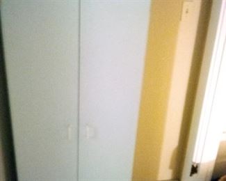 122. WHITE CABINET ABOUT 5 FOOT HIGH and 3 FOOT WIDE $30