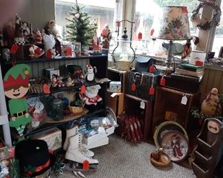 Santa Clauses, Santa fence, ice skates, hurricane lamps, vintage wooden boxes.