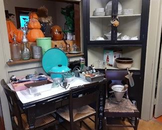 Vintage cookie cutters, aluminum ware, tupperware, enamel table and accompanying chairs.