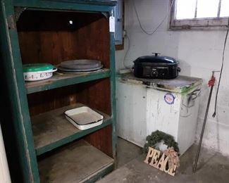 Freezer.  Green three-shelf basement shelf unit, buffet cooking/serving unit.