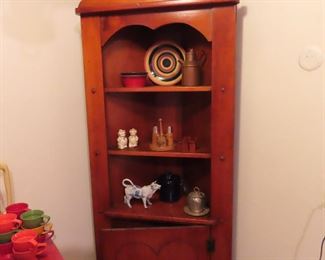 Charming vintage corner cupboard -  3 shelves w cabinet below.  Salt & peppers and cream cow pitcher bee hive honey jar. 