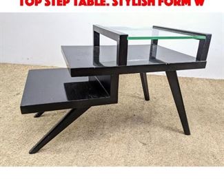 Lot 390 Ebonized Modernist Glass Top Step Table. Stylish form w