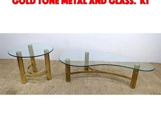 Lot 582 Pair 80s Modern Tables. Gold tone metal and glass. Ki