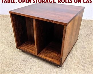 Lot 638 Rosewood Storage Cube Table. Open storage. Rolls on Cas
