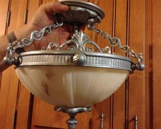 Alabaster Semi-Flushmount Light, not sure if the alabaster is real, but this small light is very heavy, so my guess it is real.