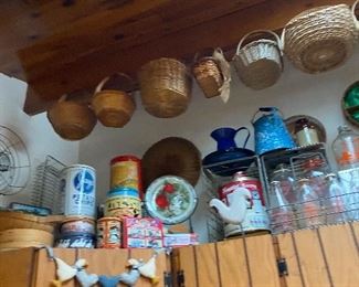 Vintage baskets, tins and jars.