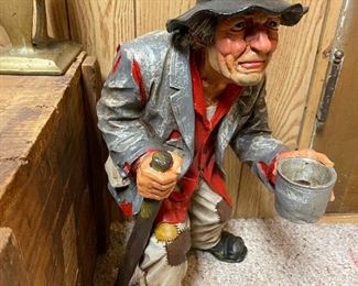 Old beggar statuette