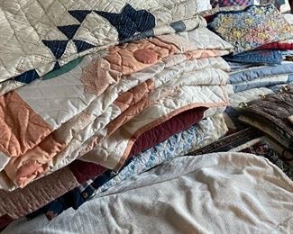 Many hand-sewn and machine-sewn quilts