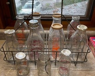 Vintage milk bottles and carrier