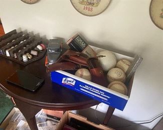 A few baseballs, one or two signed, I think stamped not original