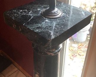 Close up of SOLID black marble pedestal