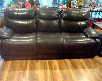 Newer charcoal faux leather  sofa with recliners each end.