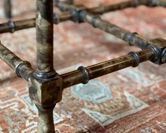 Faux tortoise bamboo cocktail table with brass-rimmed glass topper. Measures 44.5"W x 13" H x 31" D. Photo 2 of 3. 