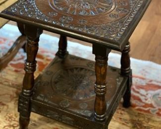 Replica carved wood side table. Measures 14" x 14" x 20" H. 