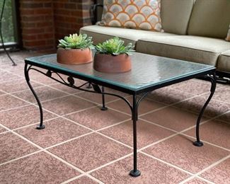 Wrought iron cocktail table with tempered glass top. 