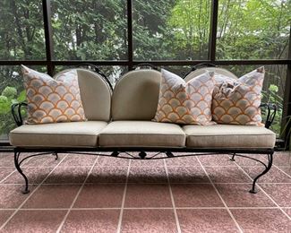 Wrought iron sofa with cushions in pristine condition. Measures 63" W. Photo 1 of 2. 