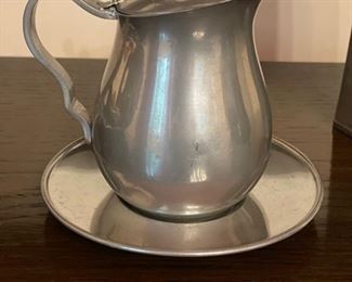 Pewter pitcher with under plate. 
