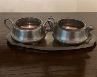 Pewter sugar and creamer with under plate. 