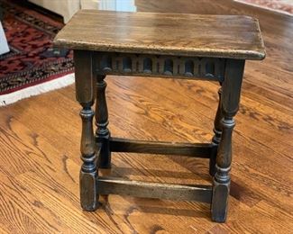 Antique stool. Measures 18" W x 10" D x 18.5" H. 