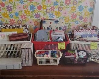 Wrapping paper, wrapping supplies, photo albums and scrapbooks.