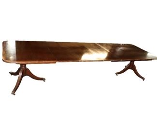 BAKER Dining Room Table with extended with 4 leaves.