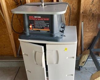 Spindal sander with cabinet