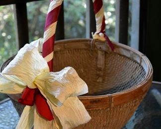 large woven basket with raffia ribbons