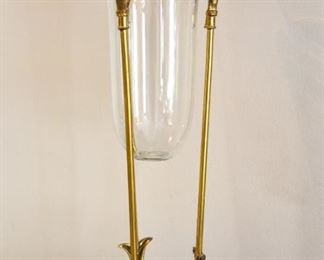 glass vase on brass stand