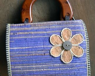 purple purse with wooden handles