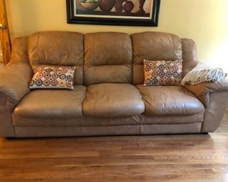 Plush, soft, leather sofa measures 90"W x 35"D x 36"H. There is a matching loveseat and chair. 