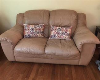 Plush leather loveseat measures 68"W x 35"D x 36"H. It is part of a fine leather living room set which includes a 3-person sofa and chair