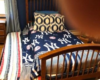 Twin sized trundle bed that may be converted into a storage unit.