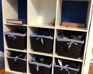 nine drawer composite storage unit measures 36"H x 12"D x 36"W. Baskets are included