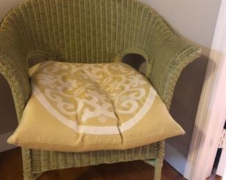 Wicker chair includes pillow.  It measures 33"H x 22"D x 28"W
