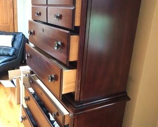 Solid wood dresser complete with mirror. Mirror is 42"H x 28"W. it rests atop this 7-drawer dresser that measures 32"H x 18"D x 56"W