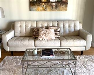 Cream color leather sofa by Chateau d’ Ax