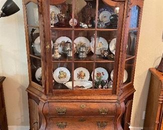 ANTIQUE BOMBE CHINA CABINET WITH "HAIRY PAW" FEET.
