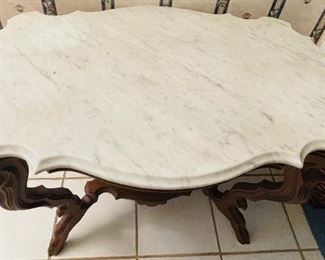 #27 - $695 - Circa 1860's  walnut turtle top table, original marble tops, ogee edging, with reclining dog on base.   • 28high 36wide 22deep