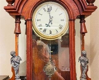 #84 - $395 Unusual Renaissance Revival mantel Clock walnut case with figural spelter elements - running condition.   • 24high 16wide 6deep
