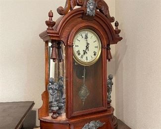 #84 - $395 Unusual Renaissance Revival mantel Clock walnut case with figural spelter elements - running condition.   • 24high 16wide 6deep