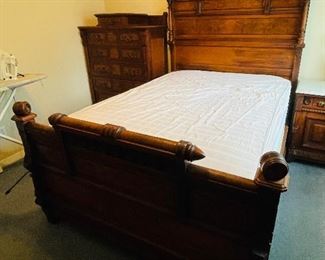 #113 - $2,995 - Antique burl walnut bedroom suite made of 4 pieces. 
1. Bed with tall headboard with mattress • 81high 58wide 80deep
2 Nightchest with marble top  • 30high 33wide 20deep
3. Tall chest with brass pulls  • 56high 41wide 21deep
4. Vanity with mirror and marble top  • 90high 51wide 25deep 