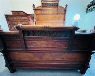 #113 - $2,995 - Antique burl walnut bedroom suite made of 4 pieces. 
1. Bed with tall headboard with mattress • 81high 58wide 80deep
2 Nightchest with marble top  • 30high 33wide 20deep
3. Tall chest with brass pulls  • 56high 41wide 21deep
4. Vanity with mirror and marble top  • 90high 51wide 25deep 