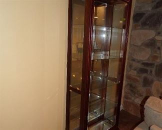 One of two lighted curio cabinets