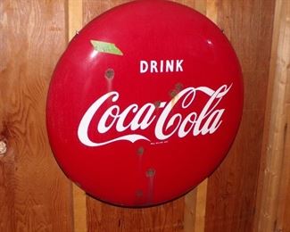 Coke button sign