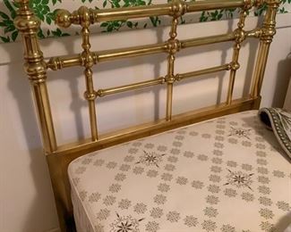 Twin Bed set featuring Brass headboards and attached bed frames