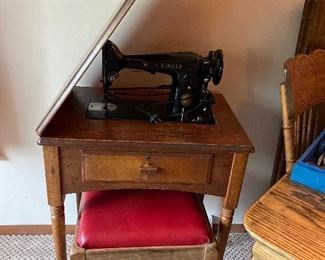 Vintage Singer sewing machine with cabinet