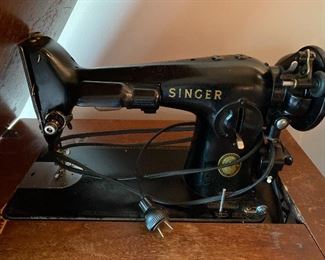 Vintage Singer sewing machine with cabinet