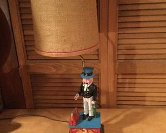 LAMP DIE CAST BASE BANK - PRESS BUTTON, CASE OPENS, UNCLE SAM DROPS THE COIN